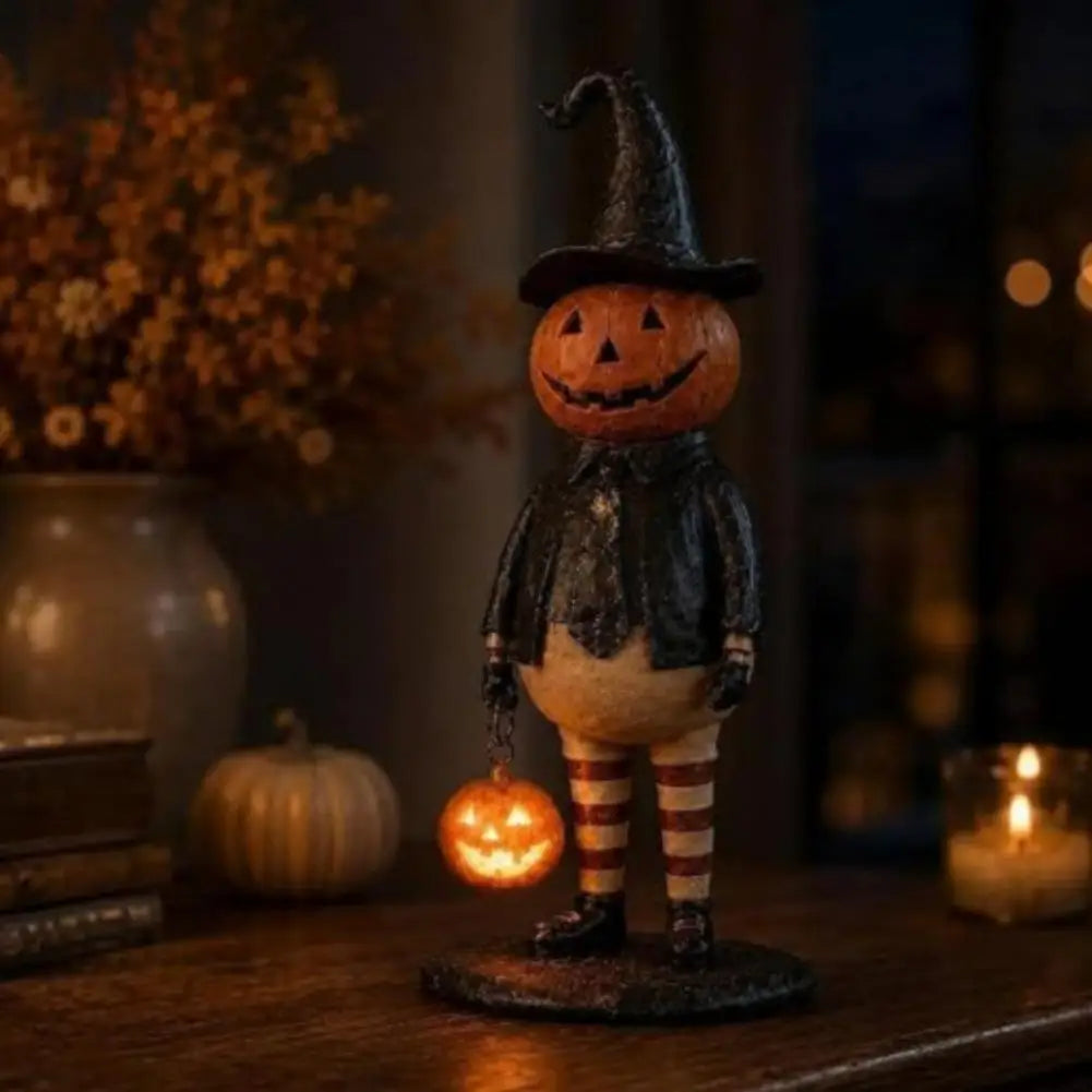 figurine citrouille halloween orange chapeau robe noire bas sculptée décoration intérieure festive