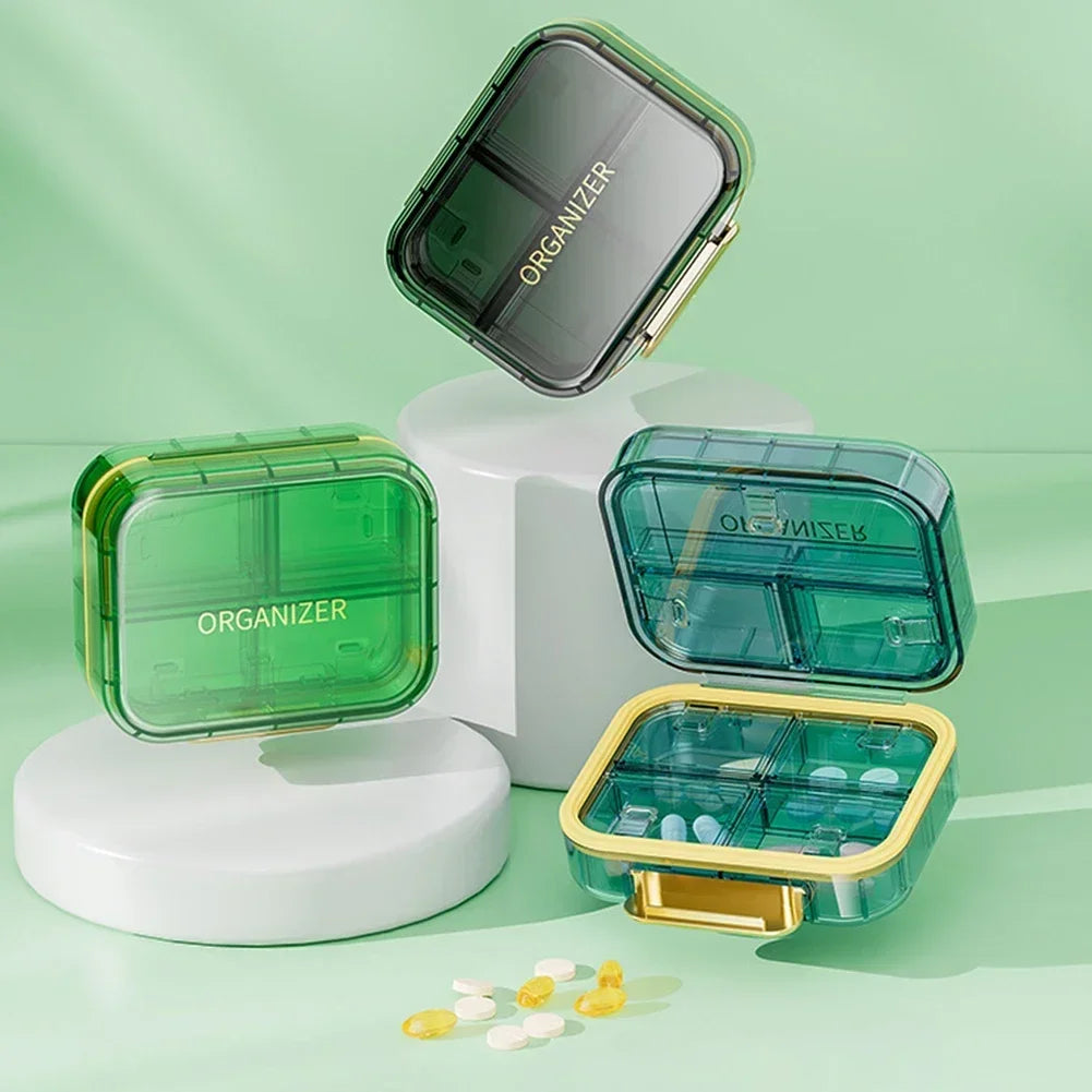 boîte rangement médicaments réutilisable transparente moderne vert bleu violet poignée dorée compartments