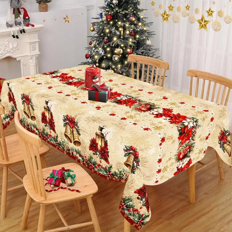 nappe table noël cloches dorées fleurs rouges feuilles vertes guirlandes flocons dorés classique