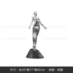 figurine humaine moderne argentée table chaises vases livres decoration intérieure robotique