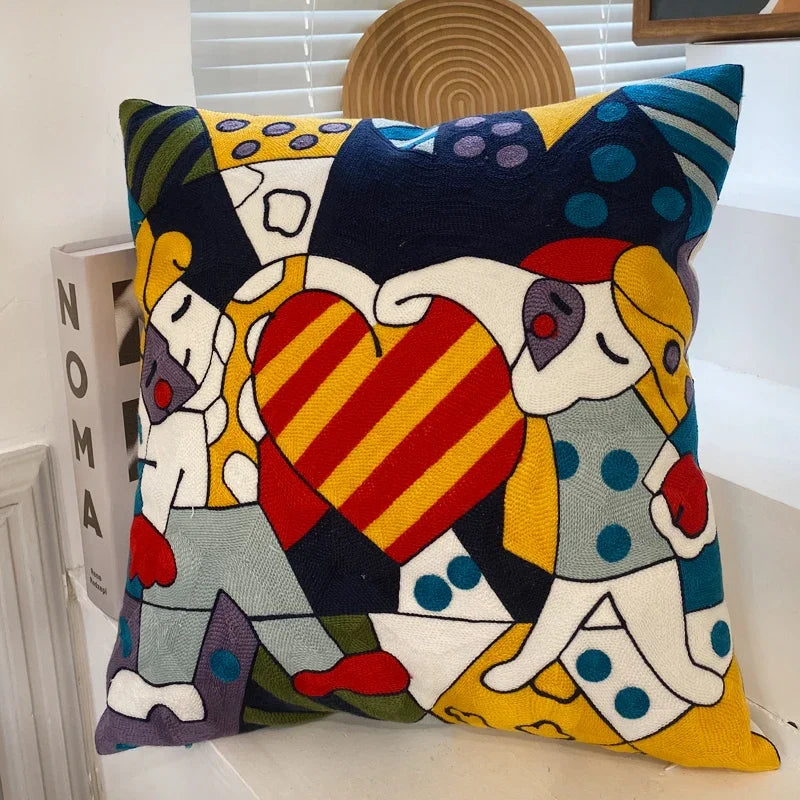 housse coussin coton brodé motifs abstraits visages stylisés moderne pop art bleu blanc orange
