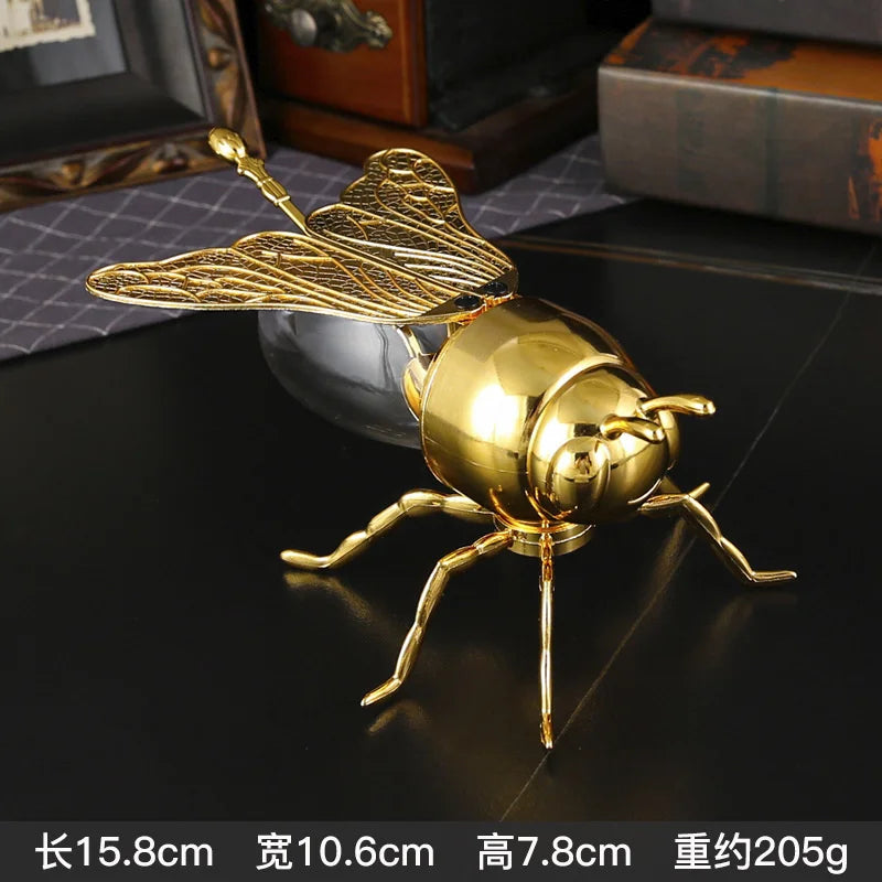 sculpture abeille or transparent ventral texte ailes cuillère dorée décoration table unique art déco
