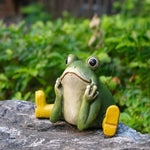 statue grenouille verte jaune bottes assise mains jointes aspect céramique décoratif animalier enfantinextérieur patio