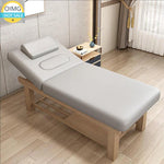 table massage professionnelle simili cuir structure bois moderne marron gris beige étagères rangement tiroirs
