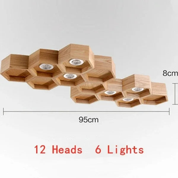 lumière suspendue bois clair nid d'abeille hexagonal modernes led câbles argentés structure géométrique
