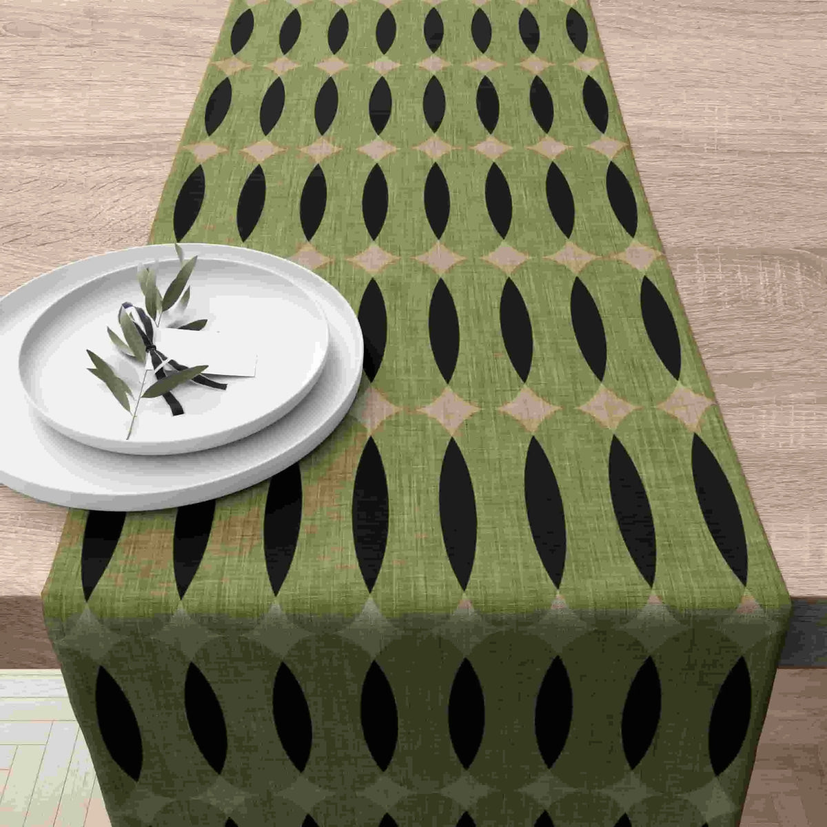 nappe lin géométrique moderne vert olive noir beige assiettes blanches branches feuilles restaurant cuisine