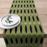 nappe lin géométrique moderne vert olive noir beige assiettes blanches branches feuilles restaurant cuisine