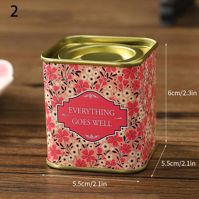 boîtes métal bleu rose noir fleurs vintage capsules étiquettes messages conservation snacks thé