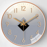 horloge murale moderne quartz aiguille dorée fond marron gris salon verre cristal