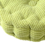 Détail du tissu tufté et du velours côtelé du coussin