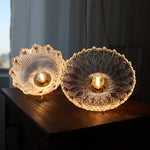 suspension lumineuse vintage vert doré motifs géométriques ampoules câbles chaînes métal