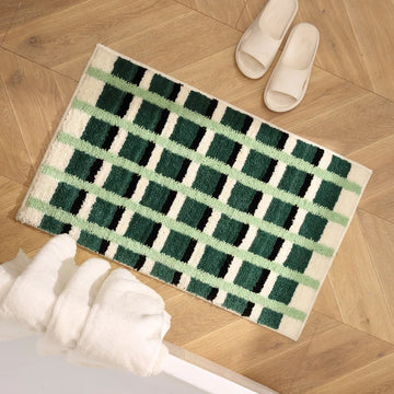 tapis bain absorbant moderne motif carreaux géométriques rose blanc salle bain