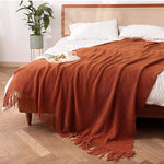 couverture lit orange motif waffle texture bulles confortable moderne canapé salon maison