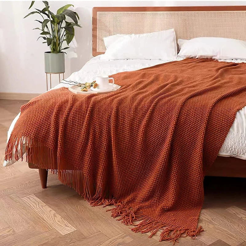 couverture lit orange motif waffle texture bulles confortable moderne canapé salon maison