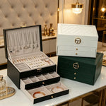 boîtes bijoux modernes élégantes compartiments cuir velours noir blanc vert rose poignées dorées