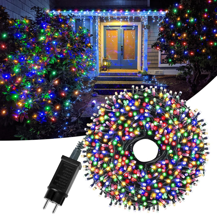 Guirlande lumineuse LED Noël bleue de 100 mètres allumée dans un jardin