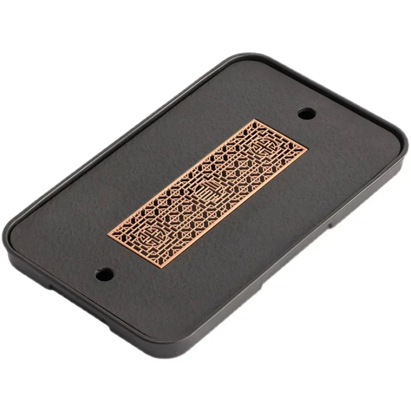 plateau thé noir insert doré traditionnel asiatique service table texture bois clair tasses théière