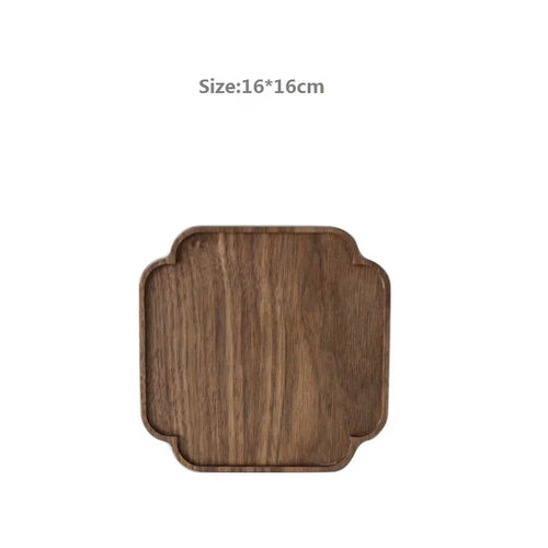 plateau bois massif moderne marron foncé minimaliste noix feuilles objets decoratifs tasse muffin cuillere
