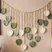 décoration murale bohème feuilles monstera deliciosa vert foncé blanc tressé suspensible 120cm