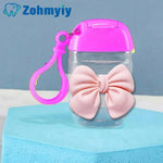 flacon gel hydroalcoolique transparent rose ruban noeud clip moderne rechargeableextérieur