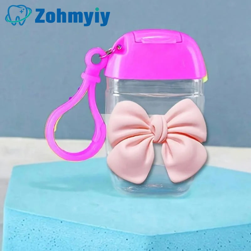 flacon gel hydroalcoolique transparent rose ruban noeud clip moderne rechargeableextérieur