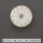horloge murale moderne or blanc cadran marbré aiguille salon étude