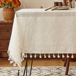 nappe table beige crème motif texturé rustique franges pompons décoration salle manger