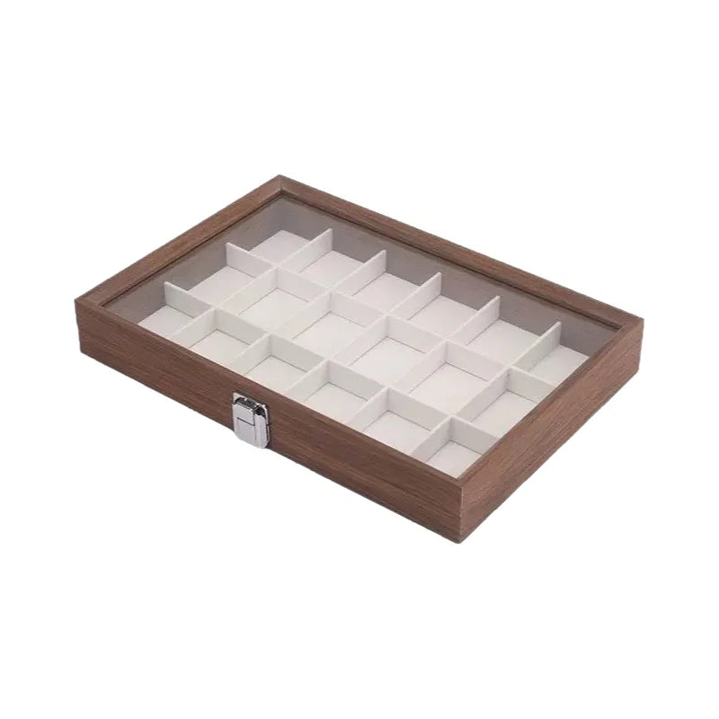 boîte bijoux contemporaine transparente compartiments blancs texture bois poignée métallique minimaliste organisation trousse toilette