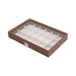 boîte bijoux contemporaine transparente compartiments blancs texture bois poignée métallique minimaliste organisation trousse toilette
