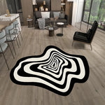tapis noir blanc moderne abstrait rayures concentriques effet ondulé salon intérieur