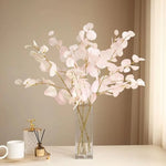 bouquet artificiel feuilles ovales rose pâle moderne vase transparent décoration intérieure minimaliste naturelle exposition