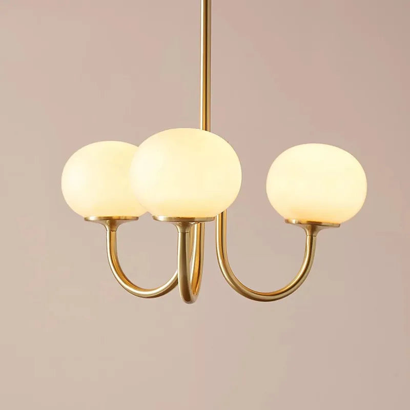 lustre moderne ampoules sphériques doré blanc rose translucides finition brillante minimaliste