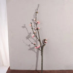 décoration intérieure bouquet fleurs prunier artificielles rose blanches vase transparent minimaliste asian