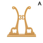 présentation éventail pliant traditionnel rouge rose jaune noir motifs floraux géométriques support bois sculpté