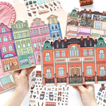 puzzle multicolore art deco détails bâtiments adhésif pièces boite rangement lunettes