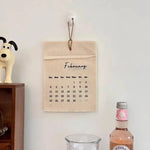 calendrier mural tissu lin beige clair minimaliste rustique pince magnétique ruban coton deco mur