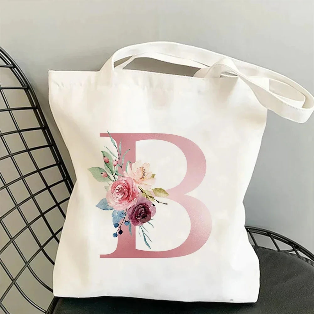 sac main blanc lettre stylisée moderne poignées détachables grandes capacités élégant toile personnalisable voyage