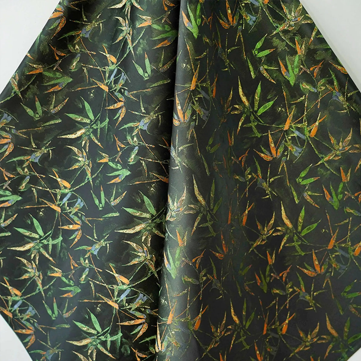 tissu imprimé feuilles bambou noir vert orange respectueux environnement largeur 165cm opacité decoration interieur
