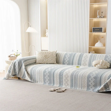 couverture canapé moderne motif géométrique gris beige deux coussins décoratifs