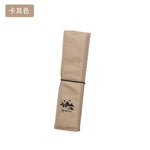 coussin pliable plein air camping noir vert olive imprimé logo blanc texture tissée pratique