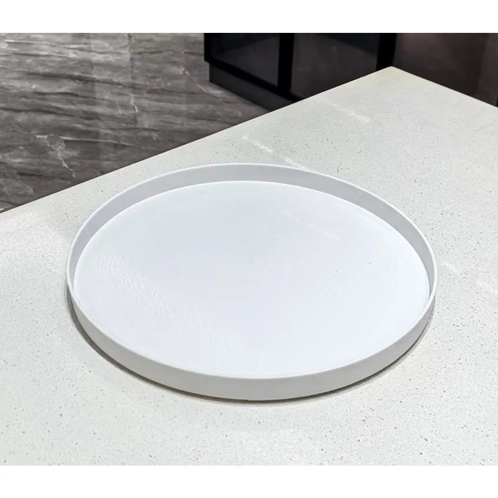 plateau rond blanc surface texturée moderne rangement cosmétiques épices bougies parfumées théière fruits gâteaux