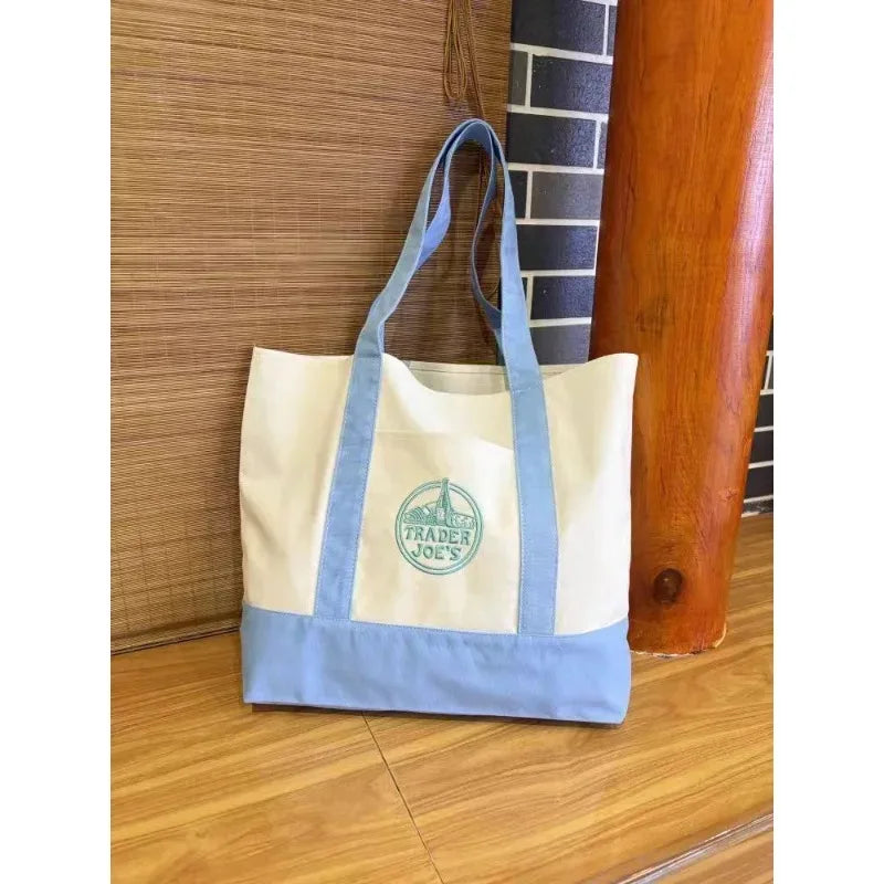 sacs toile colorés blanc vert violet rouge jaune logo trader joes poignées tissu casual