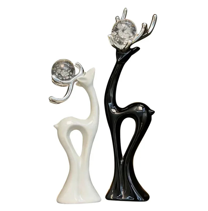 statues cerfs noir blanc sphères verre argentées décoration moderne salon meuble tv armoire vin