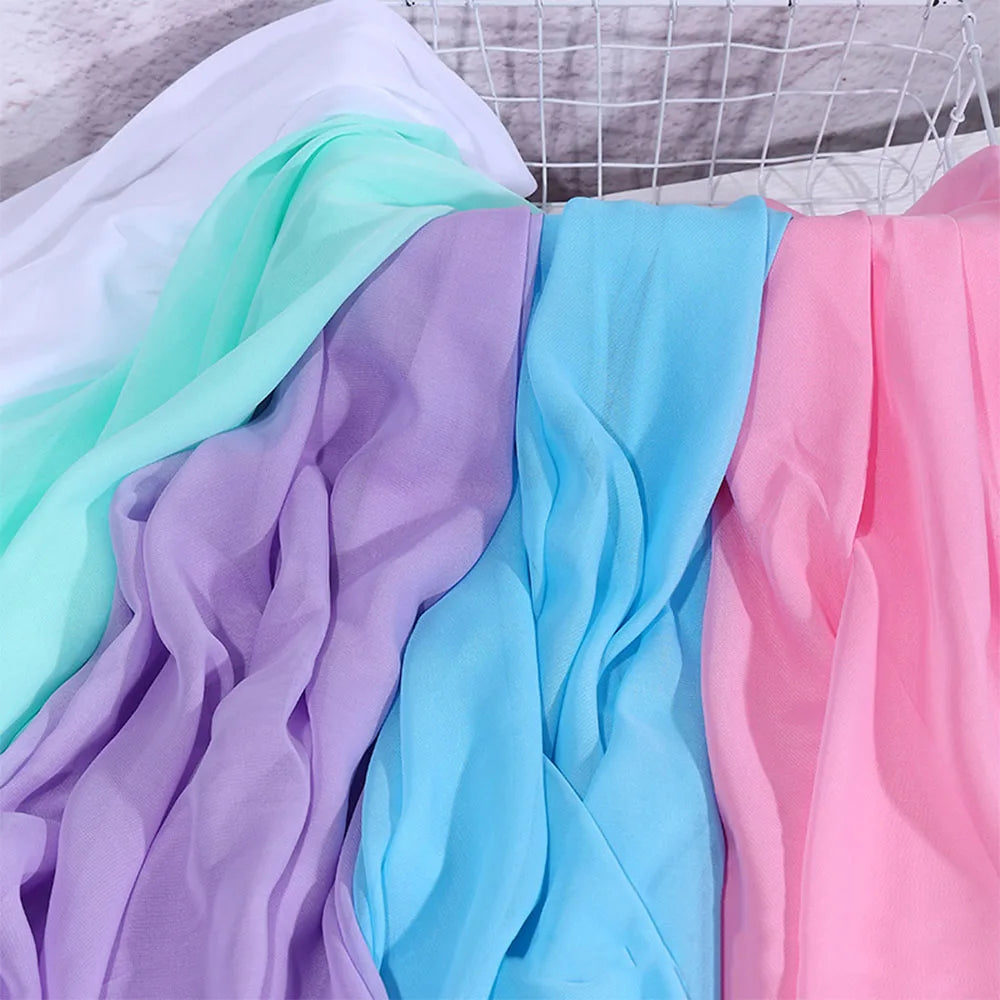tissu polyester mousseline uni translucide moderne blanc rose bleu violet 150cm cérémonie mariage statuaire