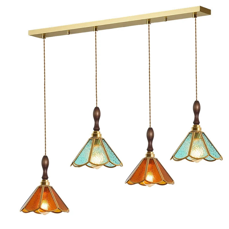 suspension lumineuse verre teinté art deco or marron bleu clair motifs géométriques opacité chaînes