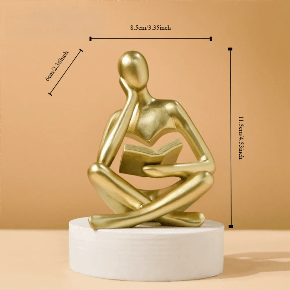 figurine deco moderne or noir blanc personne assise livre socle chambre abstraction minimalisme