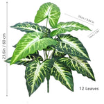 plante artificielle moderne arbre monstera feuilles vertes decoration intérieure pot blanc contemporain exposition maison