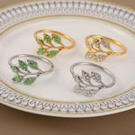 anneaux décoratifs élégants feuilles stylisées strass doré argenté vert décoration table événement