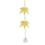 mobile décoratif doré transparent fleurs feuilles cristal chaîne dorée artisanal élégant fenêtre