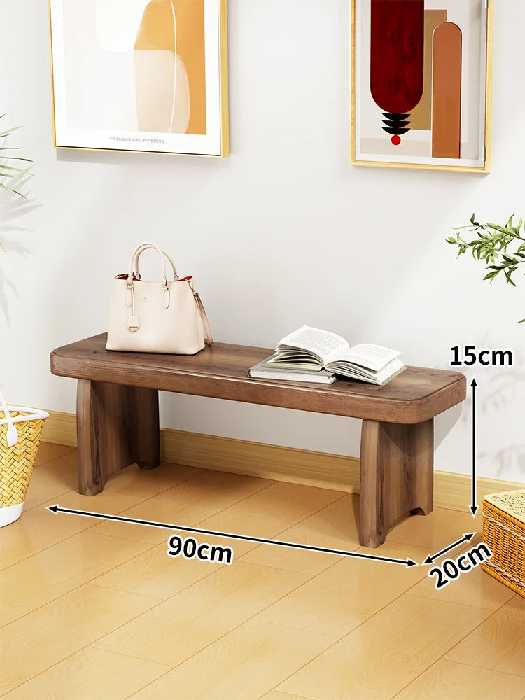 Banc bois marron clair texture naturelle moderne salon tabouret sac main livre ouvert decoration